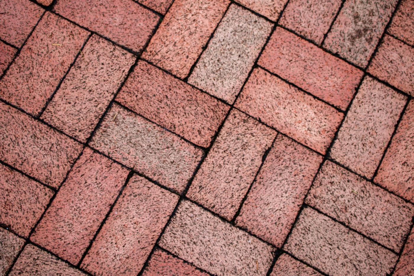 Red clay block paving laid in a basketweave pattern