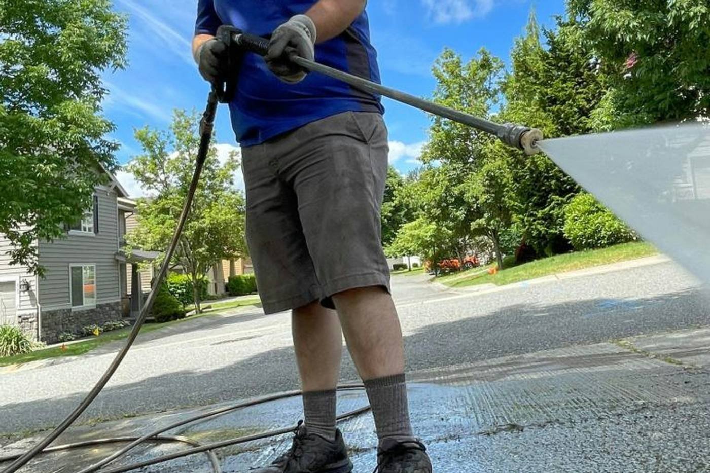 A driveway being pressure washed