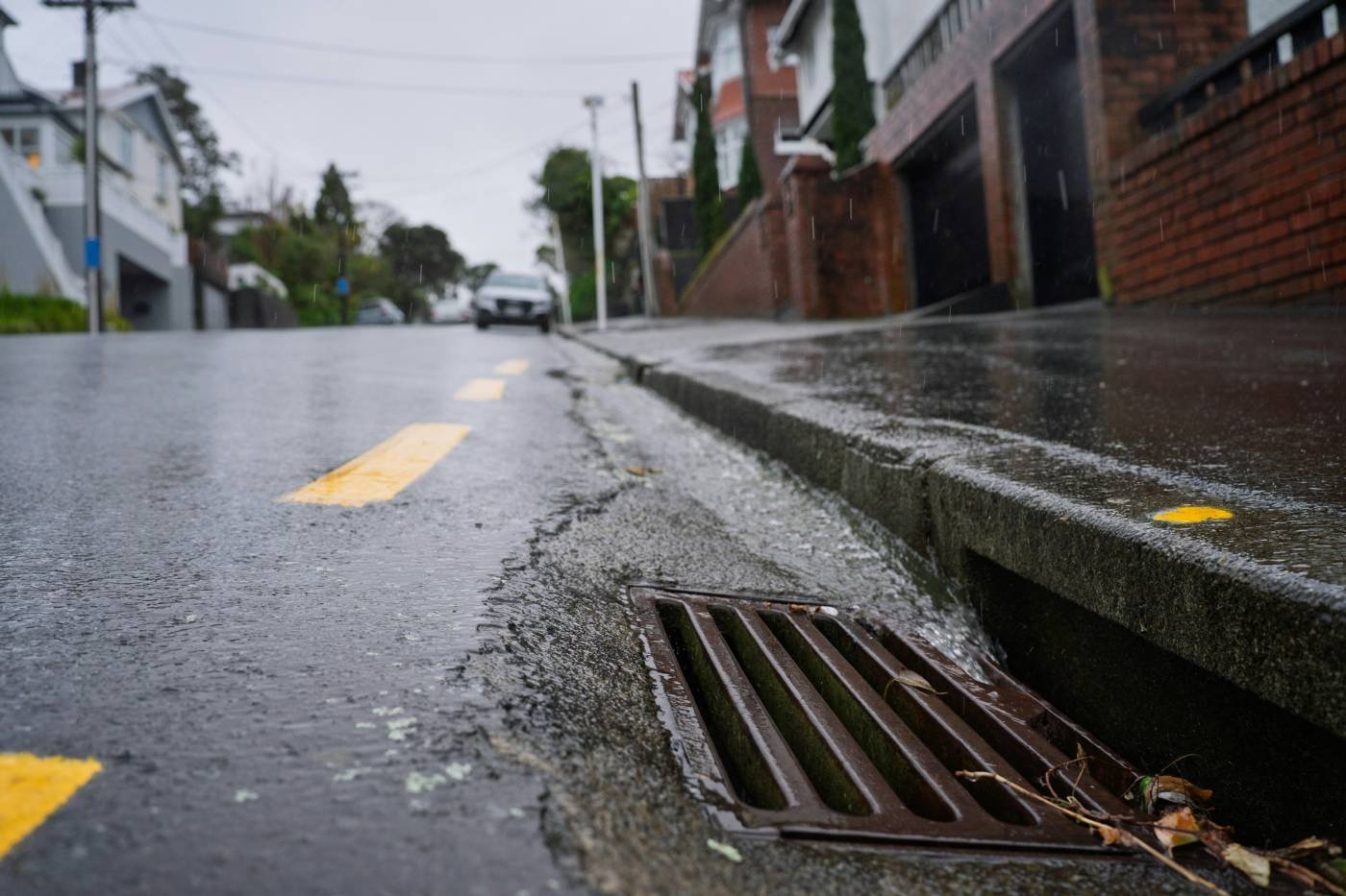 A kerb and road gully on a residential street